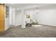 Basement living room area with a decorative rug, wall art and recessed lighting at 6742 Marshall St, Arvada, CO 80003
