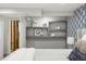 This bedroom offers unique wall shelves decorated with art and decorative pieces at 6742 Marshall St, Arvada, CO 80003