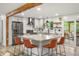 Modern kitchen featuring granite countertops, stainless steel appliances, and a center island with seating at 6742 Marshall St, Arvada, CO 80003