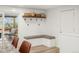 An eat-in nook featuring built-in bench seating, a sliding glass door and wood floors at 6742 Marshall St, Arvada, CO 80003