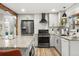 Well-equipped kitchen with modern appliances, granite countertops, and stylish cabinetry at 6742 Marshall St, Arvada, CO 80003
