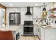 Modern kitchen with stainless steel appliances, granite countertops, and a sleek design at 6742 Marshall St, Arvada, CO 80003