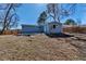 Spacious backyard with a concrete patio and partial fencing on a sunny day at 10025 W 8Th Ave, Lakewood, CO 80215
