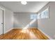 Bedroom featuring hardwood floors, neutral paint and natural light from the windows at 10025 W 8Th Ave, Lakewood, CO 80215