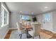Bright dining room features hardwood floors, recessed lighting, and large windows providing natural light at 10025 W 8Th Ave, Lakewood, CO 80215