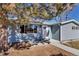 Cozy single-story home with a well-maintained yard and blue siding at 10025 W 8Th Ave, Lakewood, CO 80215