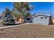 Charming single-story home with mature trees and a well-manicured front yard at 10025 W 8Th Ave, Lakewood, CO 80215
