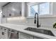 Gourmet kitchen with quartz countertops, stainless steel sink and modern faucet at 10025 W 8Th Ave, Lakewood, CO 80215
