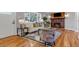Stylish living room features hardwood floors, a brick fireplace, and comfortable seating at 10025 W 8Th Ave, Lakewood, CO 80215