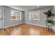 Open space with hardwood flooring, bright windows, and neutral paint, creating an inviting atmosphere at 10025 W 8Th Ave, Lakewood, CO 80215