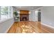 Cozy living room features hardwood floors, a brick fireplace with wood mantle, and recessed lighting at 10025 W 8Th Ave, Lakewood, CO 80215