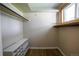 Spacious walk-in closet with built-in shelving, providing ample storage for clothing and accessories at 885 Balsam St, Lakewood, CO 80214