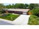 Charming brick home with a well-maintained lawn, mature trees, and a spacious driveway at 885 Balsam St, Lakewood, CO 80214