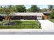Charming brick home with a well-maintained lawn, mature trees, and a spacious driveway at 885 Balsam St, Lakewood, CO 80214