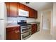 Functional kitchen with stainless steel appliances, ample cabinet space, and modern upgrades at 885 Balsam St, Lakewood, CO 80214