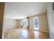 Bright living room with hardwood floors, large windows, and neutral paint, creating a welcoming atmosphere at 885 Balsam St, Lakewood, CO 80214