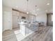 Modern kitchen with a breakfast bar, stainless steel microwave, and a view to the outside through an awning window at 22083 E 38Th Pl, Aurora, CO 80019