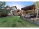 Backyard area featuring a pergola and grill at 14582 Homestead Pl, Broomfield, CO 80023
