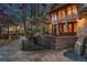Beautiful backyard patio with outdoor seating and bar area, illuminated by evening light at 14582 Homestead Pl, Broomfield, CO 80023