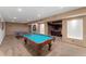 Carpeted basement game room featuring a pool table and ping pong setup at 14582 Homestead Pl, Broomfield, CO 80023
