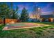 Backyard basketball court with colorful surface, perfect for sports and outdoor activities at 14582 Homestead Pl, Broomfield, CO 80023