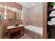 Bathroom featuring mosaic tile work, a soaking tub, and vessel sink at 14582 Homestead Pl, Broomfield, CO 80023