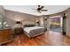 Luxurious bedroom featuring a decorative accent wall and access to an outdoor patio at 14582 Homestead Pl, Broomfield, CO 80023