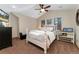 Relaxing bedroom with high ceilings, large windows, and a ceiling fan at 14582 Homestead Pl, Broomfield, CO 80023