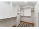 Walk-in closet with custom shelving and drawers at 14582 Homestead Pl, Broomfield, CO 80023
