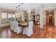 Open-concept dining room features hardwood floors, stylish furnishings, and natural lighting at 14582 Homestead Pl, Broomfield, CO 80023