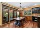 Dining room with hardwood floors, rustic furnishings, and natural lighting, creating a welcoming atmosphere at 14582 Homestead Pl, Broomfield, CO 80023