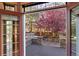 Hot tub surrounded by a stone patio and a lush, colorful tree at 14582 Homestead Pl, Broomfield, CO 80023
