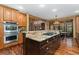 Modern kitchen with stainless steel appliances, a gas cooktop, and granite countertops at 14582 Homestead Pl, Broomfield, CO 80023