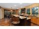 Spacious kitchen with a large island, granite countertops, and views of the backyard at 14582 Homestead Pl, Broomfield, CO 80023