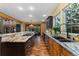 Open concept kitchen with an island, stainless steel appliances, and hardwood floors at 14582 Homestead Pl, Broomfield, CO 80023