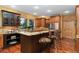 Bright kitchen with granite countertops, stainless steel appliances, and a breakfast bar at 14582 Homestead Pl, Broomfield, CO 80023