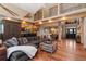 Open living room showcases hardwood floors, a comfortable sofa, and decorative details at 14582 Homestead Pl, Broomfield, CO 80023