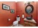 Unique powder room featuring an oval mirror and vessel sink at 14582 Homestead Pl, Broomfield, CO 80023