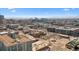 Expansive aerial view showcasing the city's diverse neighborhoods, with a mix of residential and commercial areas under a clear blue sky at 2322 Arapahoe St, Denver, CO 80205