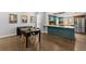 Cozy dining area adjacent to a modern kitchen with stylish decor and ample lighting at 2322 Arapahoe St, Denver, CO 80205