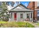 Charming home featuring a inviting front porch, and freshly painted exterior, creating an inviting facade at 2322 Arapahoe St, Denver, CO 80205