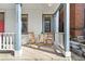 Inviting front porch with seating and a small table, perfect for enjoying the outdoors at 2322 Arapahoe St, Denver, CO 80205