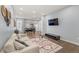 Open living space with hardwood floors leading to a modern kitchen and dining area at 2322 Arapahoe St, Denver, CO 80205