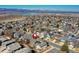 An aerial view of a neighborhood with a pin indicating one of the homes, highlighting mountain and lake scenery at 3224 White Oak St, Highlands Ranch, CO 80129