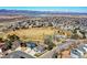 Scenic aerial view of the neighborhood with a large park, playground, lake and mountains in the background at 3224 White Oak St, Highlands Ranch, CO 80129