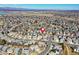 An overhead shot pinpoints a neighborhood location, amidst similar houses, with green trees and winding streets at 3224 White Oak St, Highlands Ranch, CO 80129