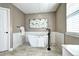 Modern bathroom featuring a standalone tub, sleek vanity, and stylish decor at 3224 White Oak St, Highlands Ranch, CO 80129