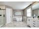 Modern bathroom with standalone tub, sleek vanity, and walk-in shower at 3224 White Oak St, Highlands Ranch, CO 80129