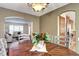 Dining area featuring a wooden table and access to the living room and kitchen at 3224 White Oak St, Highlands Ranch, CO 80129