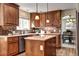 Kitchen featuring wooden cabinetry, stainless steel appliances, and a center island at 3224 White Oak St, Highlands Ranch, CO 80129